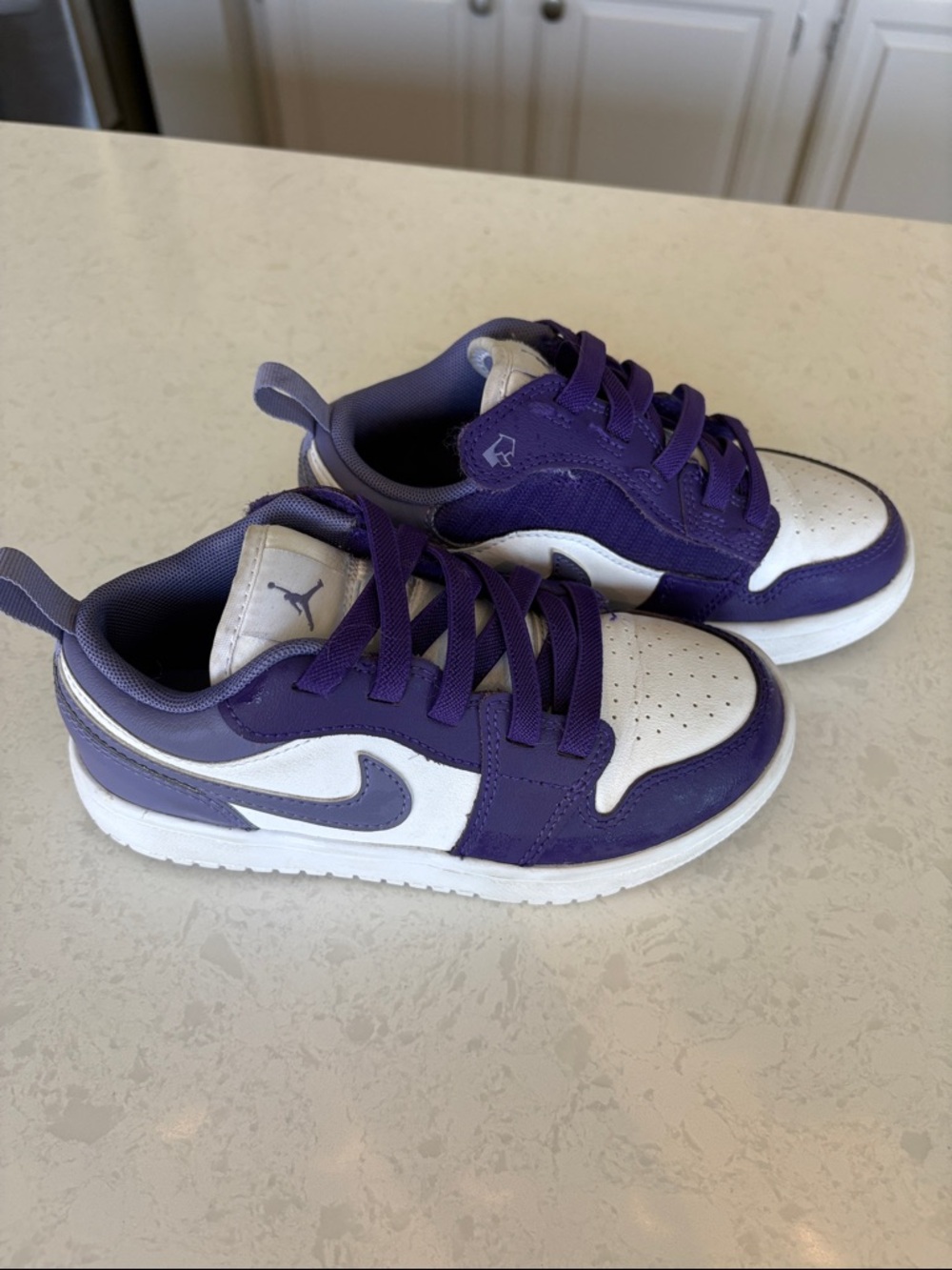 Air Jordan Girls purple and white sneakers